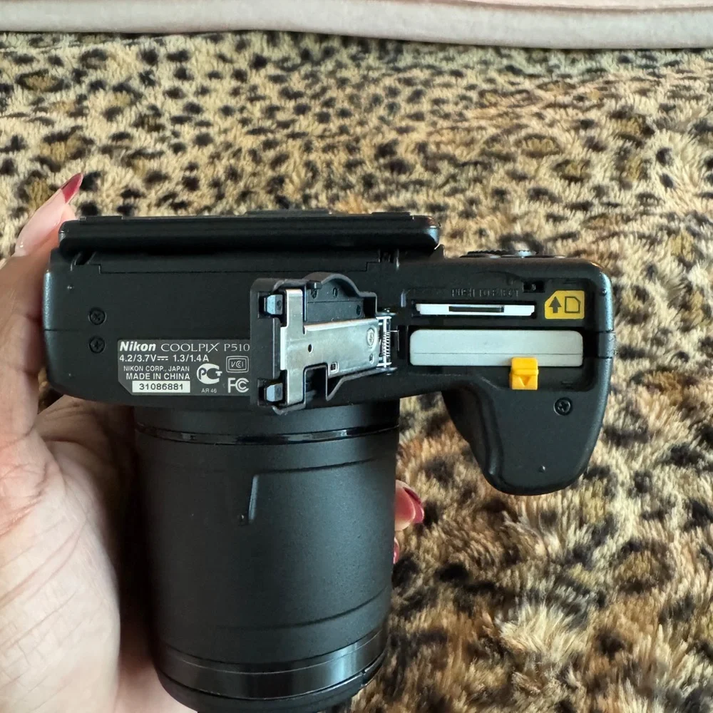 Nikon Black Camera with White Accessories